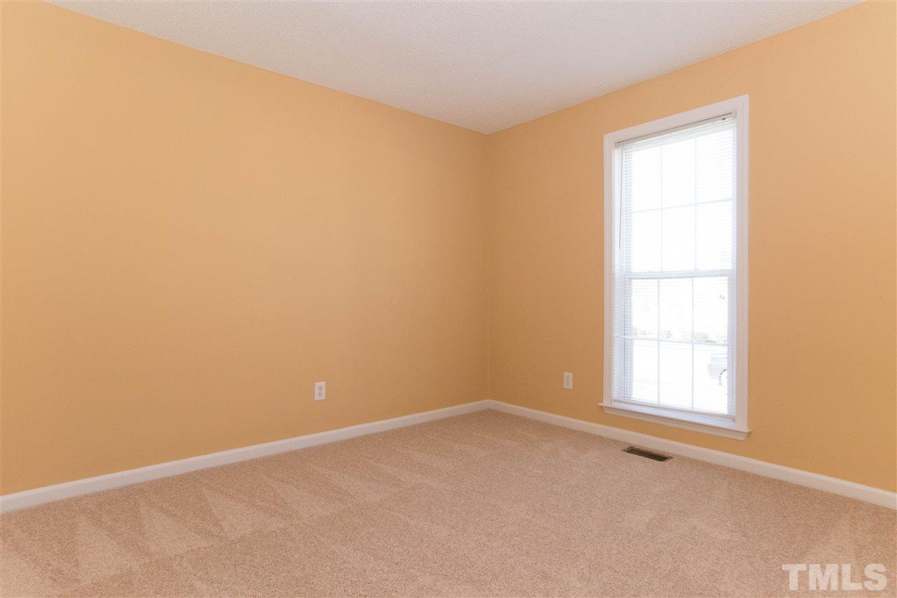 7112 Spanglers Spring Way Raleigh, NC 27610 - Photo 14 of 19 an empty room with a window