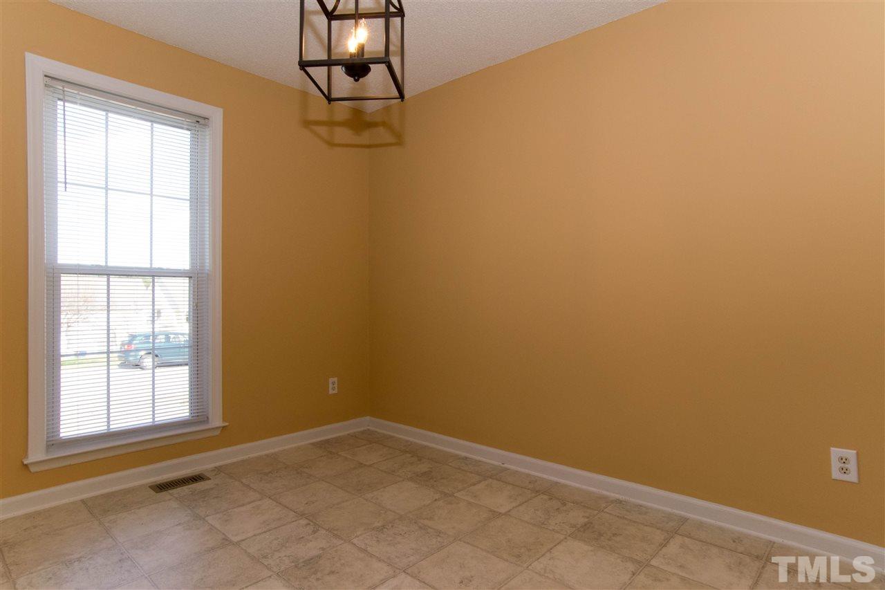 7112 Spanglers Spring Way Raleigh, NC 27610 - Photo 4 of 19 an empty room with windows