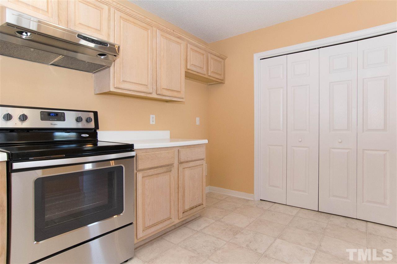7112 Spanglers Spring Way Raleigh, NC 27610 - Photo 9 of 19 a stove top oven sitting inside of a kitchen