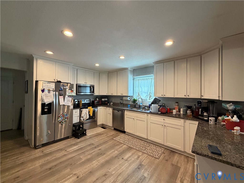 1124 Myrtle Street Suffolk, VA 23434 - Photo 4 of 15 Kitchen featuring white shaker-style cabinetry, st