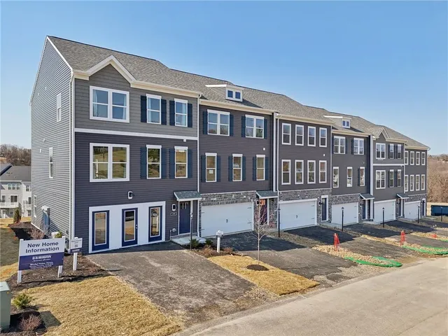 a front view of a building with lot of windows