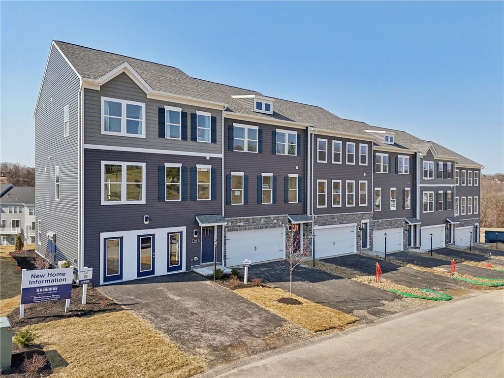 a front view of a building with lot of windows