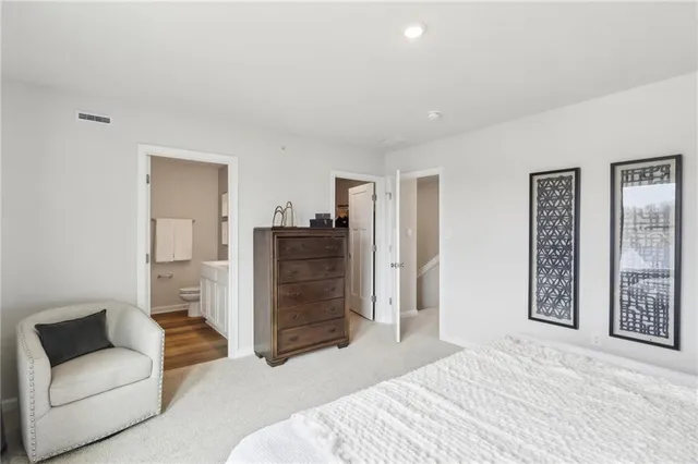 a bedroom with a bed and a couch