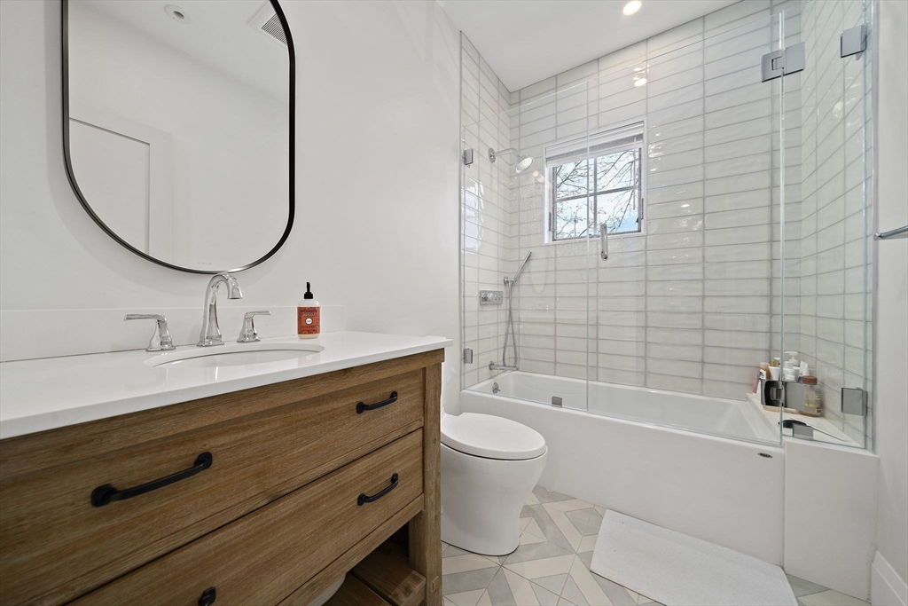 144 Linden Street, Unit 2 Wellesley, MA 02482 - Photo 15 of 28 a bathroom with a sink a toilet and a mirror