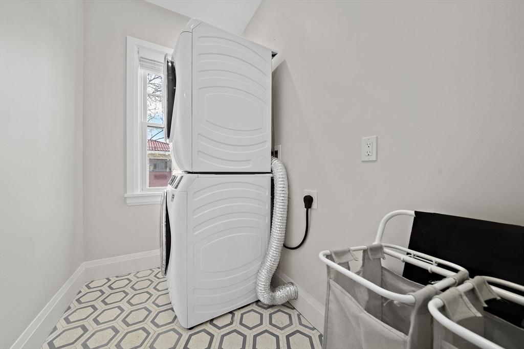 144 Linden Street, Unit 2 Wellesley, MA 02482 - Photo 17 of 28 a utility room with dryer and washer