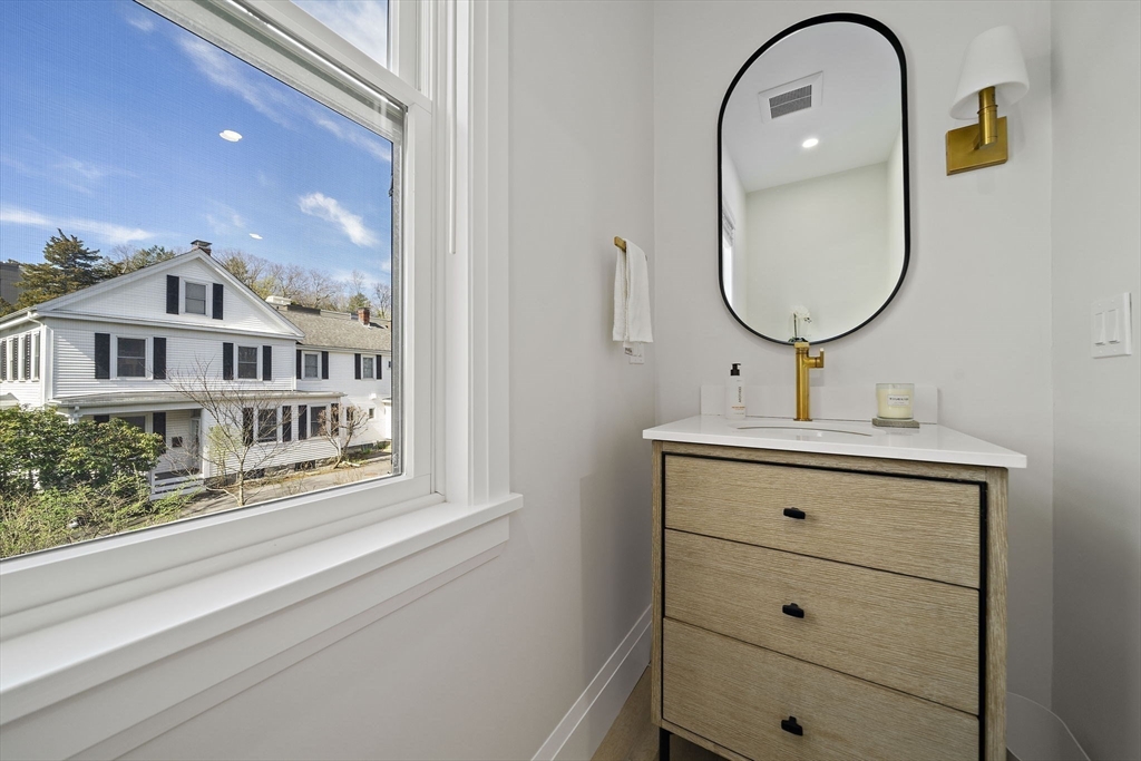 144 Linden Street, Unit 2 Wellesley, MA 02482 - Photo 18 of 28 a bathroom with a sink and a mirror