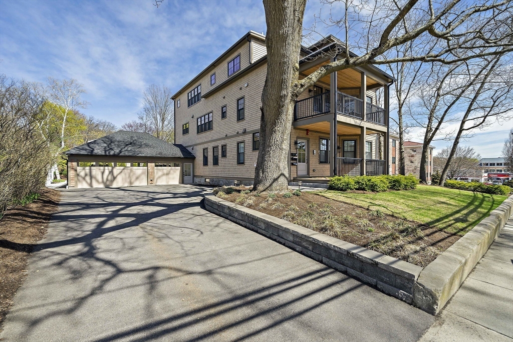 144 Linden Street, Unit 2 Wellesley, MA 02482 - Photo 22 of 28 a view of a building with a street