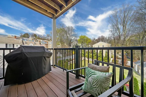 a view of a balcony with furniture