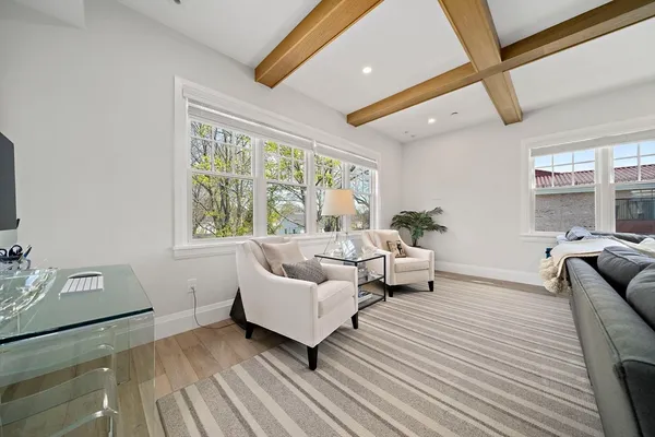 a spacious bedroom with a bed and a large window
