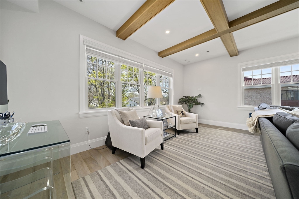 144 Linden Street, Unit 2 Wellesley, MA 02482 - Photo 7 of 28 a spacious bedroom with a bed and a large window