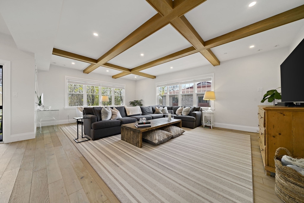 144 Linden Street, Unit 2 Wellesley, MA 02482 - Photo 9 of 28 a living room with furniture and a wooden floor