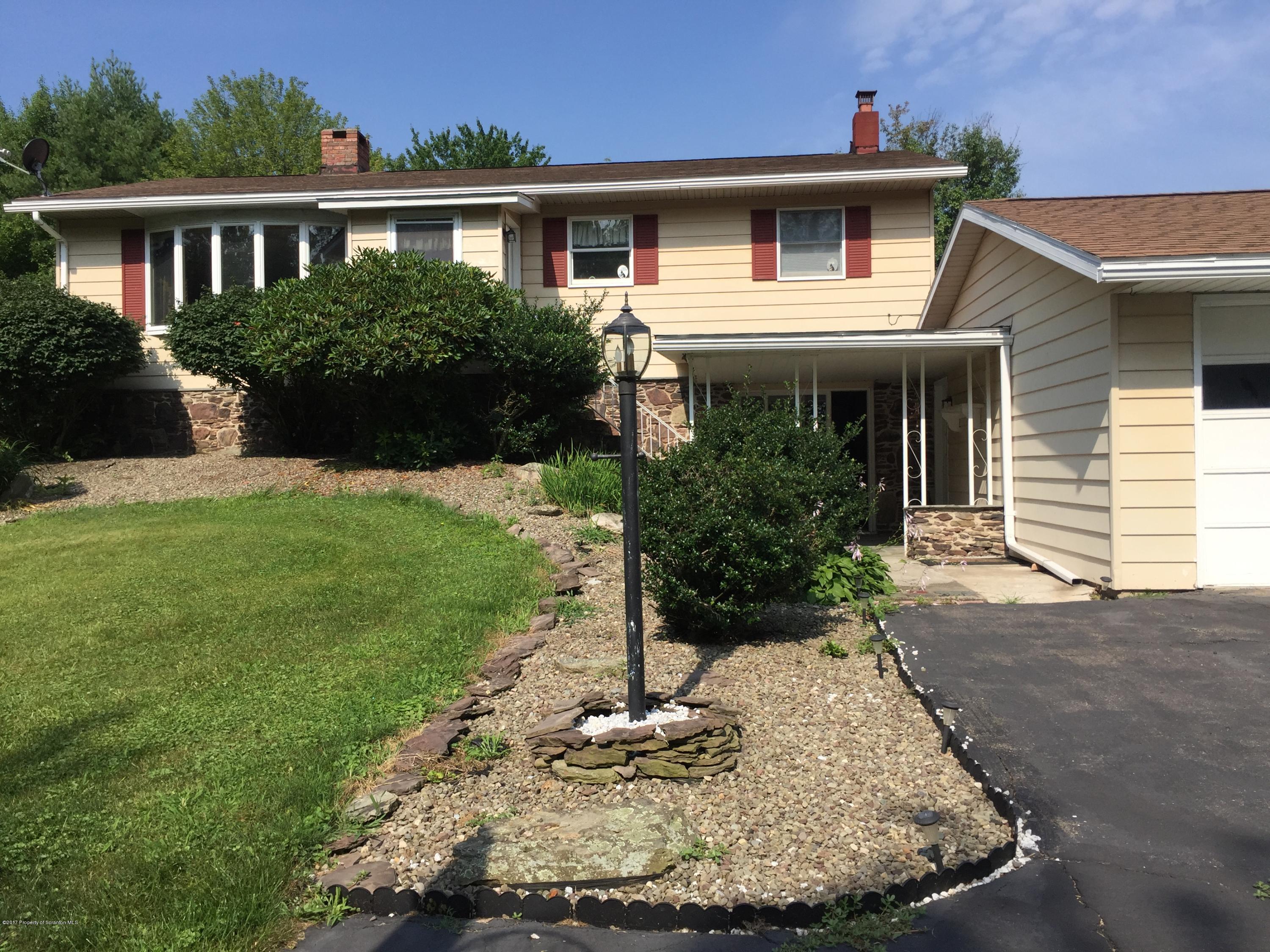 154 Hall Road Meshoppen, PA 18630 - Photo 1 of 35 a front view of a house with a yard