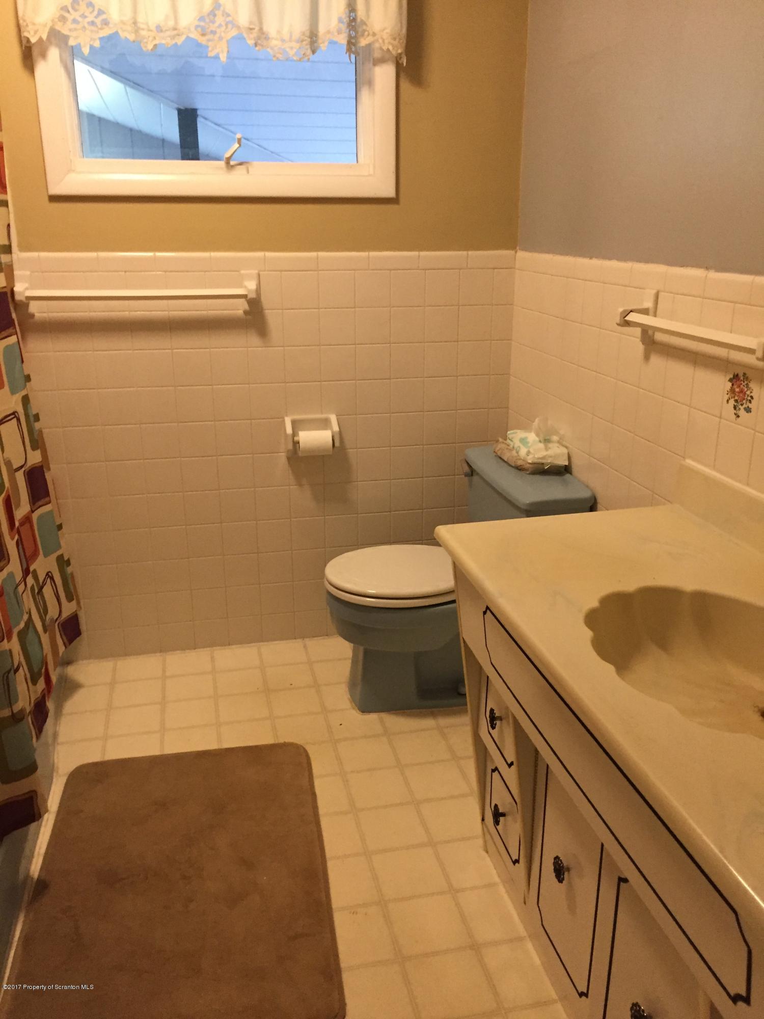 154 Hall Road Meshoppen, PA 18630 - Photo 14 of 35 a bathroom with a sink and a toilet