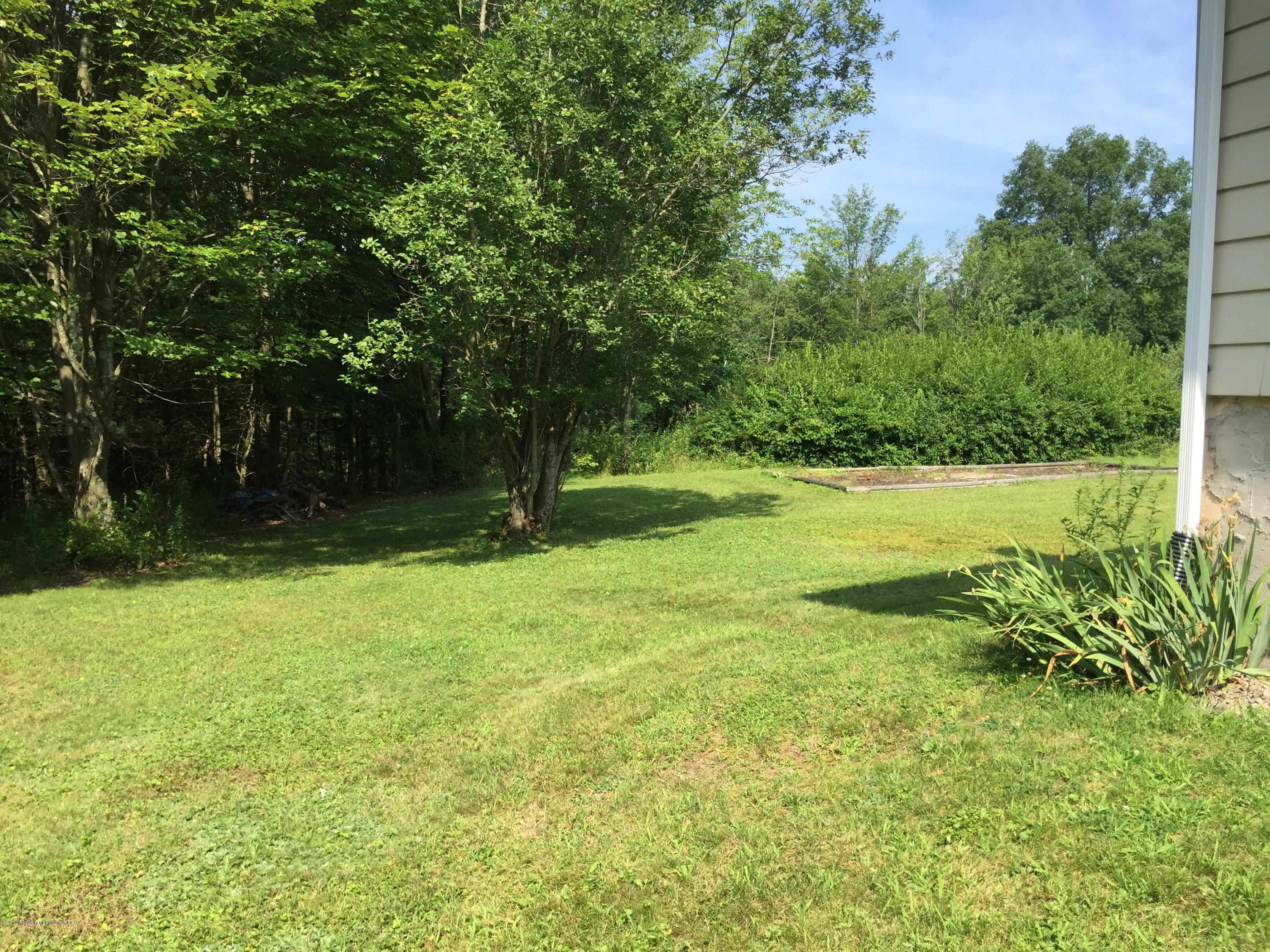 154 Hall Road Meshoppen, PA 18630 - Photo 29 of 35 a backyard of a house with lots of green space