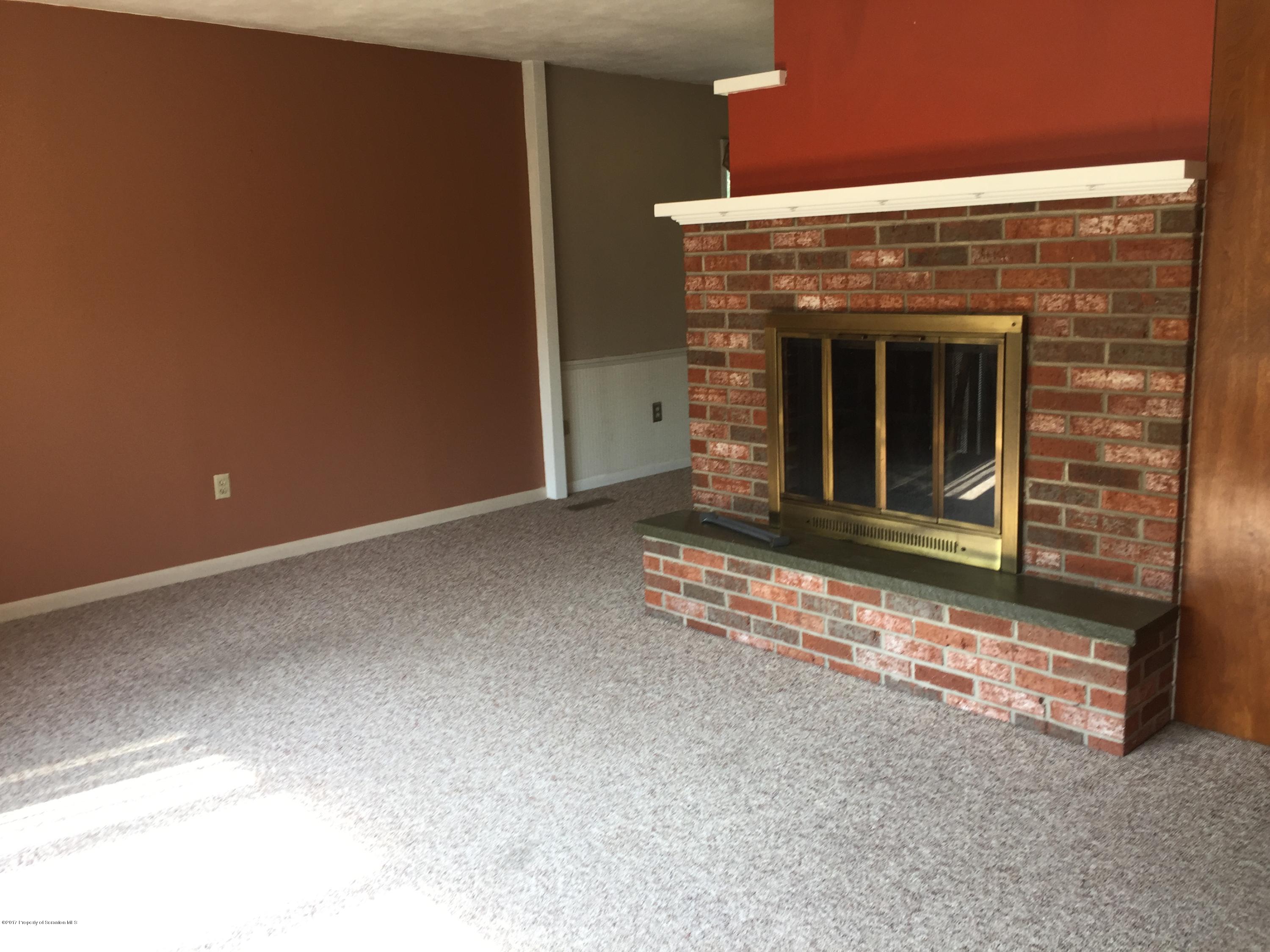 154 Hall Road Meshoppen, PA 18630 - Photo 3 of 35 a view of fireplace with an empty room