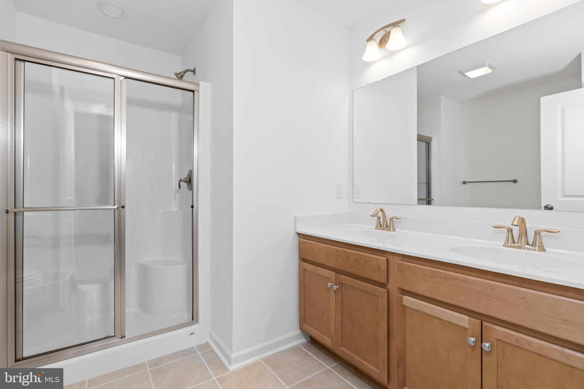 866 Mapleton Avenue Middletown, DE 19709 - Photo 14 of 22 a bathroom with a double vanity sink and mirror