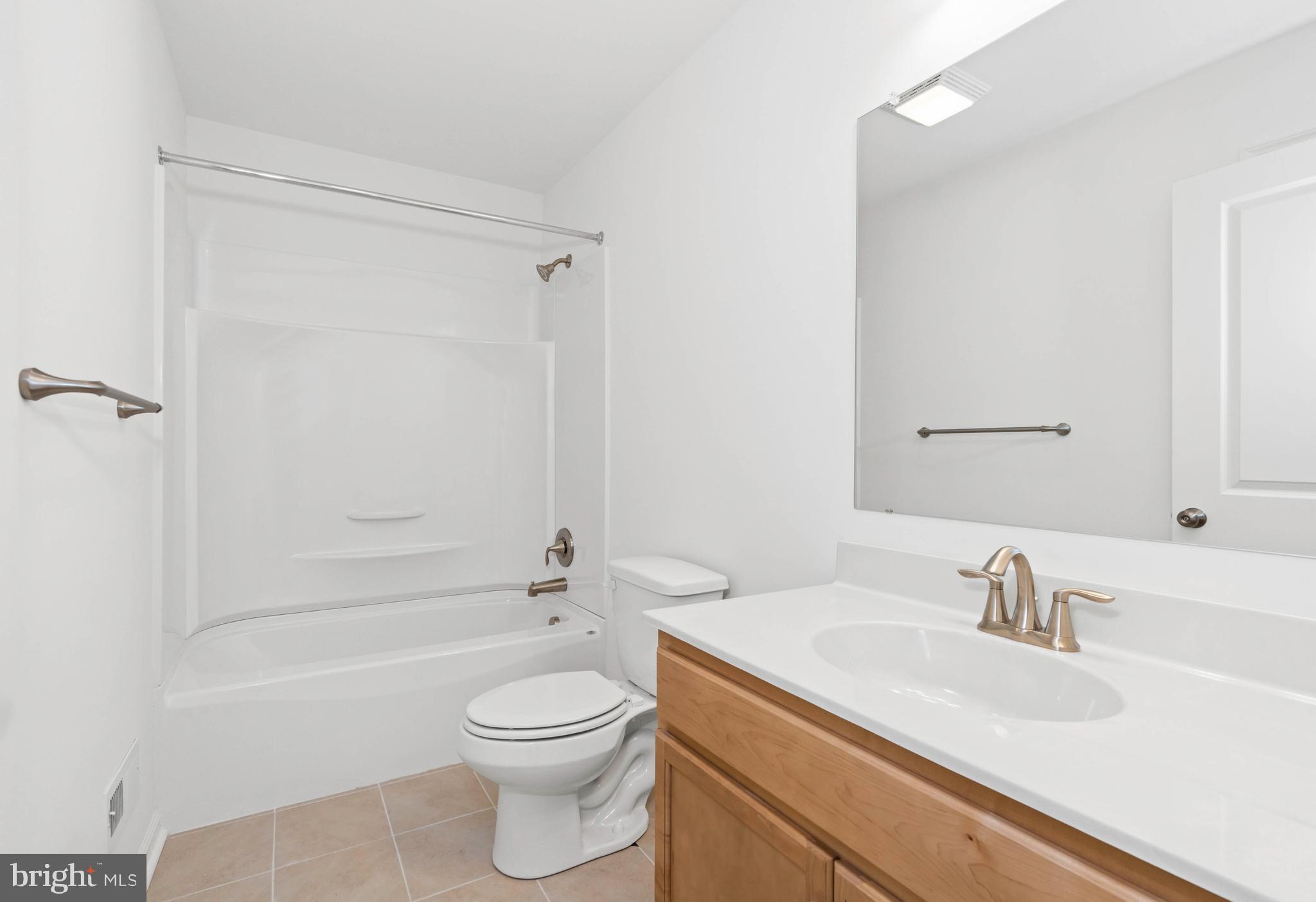 866 Mapleton Avenue Middletown, DE 19709 - Photo 17 of 22 a bathroom with a sink a toilet and shower