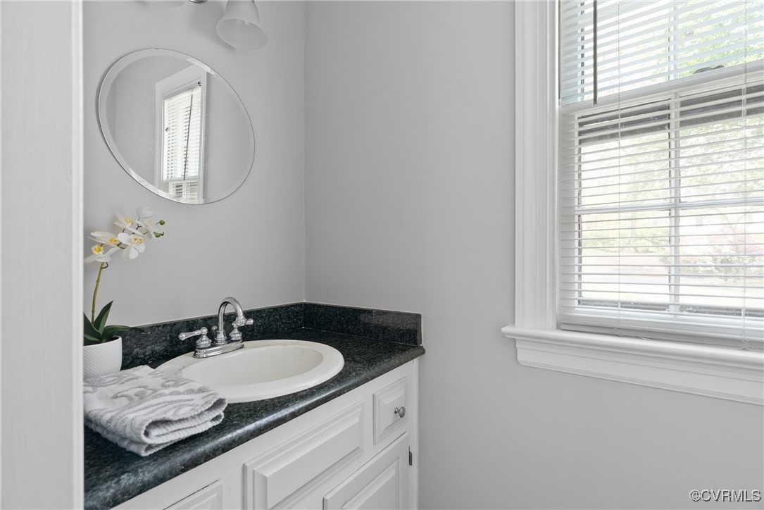 3600 Stoney Ridge Road Midlothian, VA 23112 - Photo 17 of 43 a bathroom with a granite countertop sink and a mirror