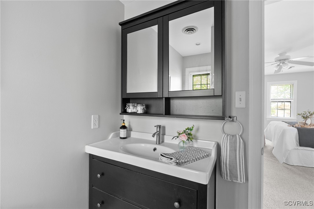 3600 Stoney Ridge Road Midlothian, VA 23112 - Photo 27 of 43 a bathroom with a sink vanity and mirror