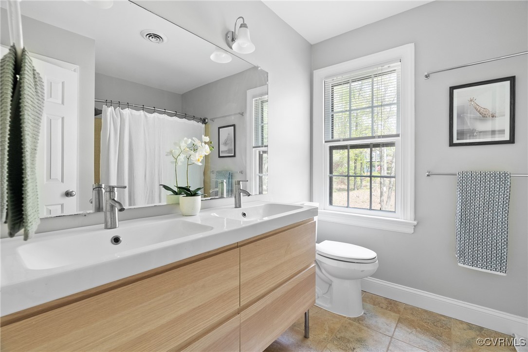3600 Stoney Ridge Road Midlothian, VA 23112 - Photo 30 of 43 a bathroom with a double vanity sink toilet and a tub
