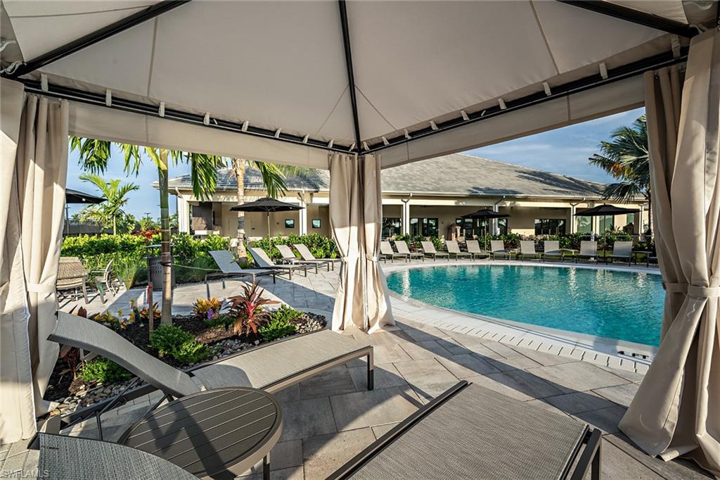15324 Lucerna Street, Unit 201 Naples, FL 34114 - Photo 15 of 34 View of swimming pool featuring a patio