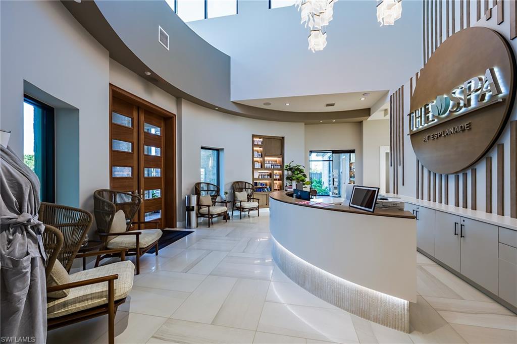 15324 Lucerna Street, Unit 201 Naples, FL 34114 - Photo 25 of 34 Reception with an inviting chandelier