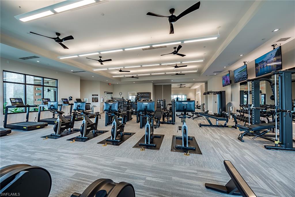15324 Lucerna Street, Unit 201 Naples, FL 34114 - Photo 27 of 34 Gym featuring ceiling fan and light colored carpet