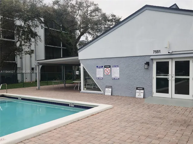 a view of a house with a backyard and a window