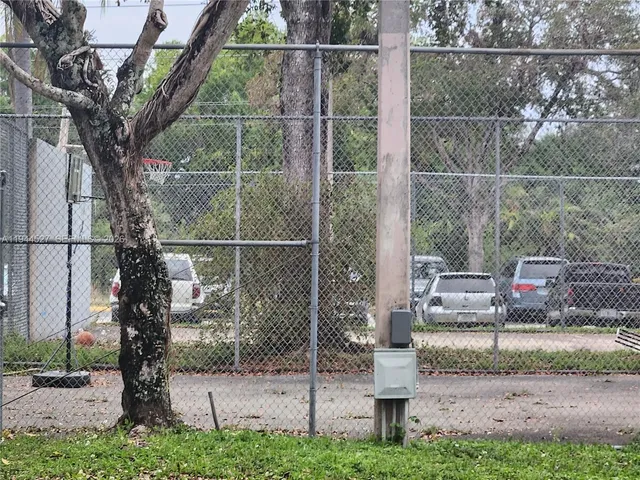 a view of a house with a tree in front of it
