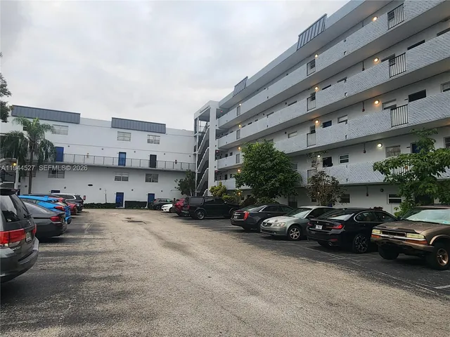 a view of a cars parked in front of a building