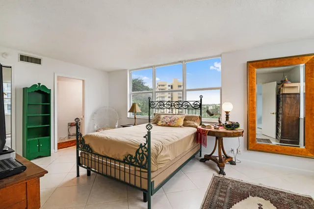 a bedroom with a bed and a table in it