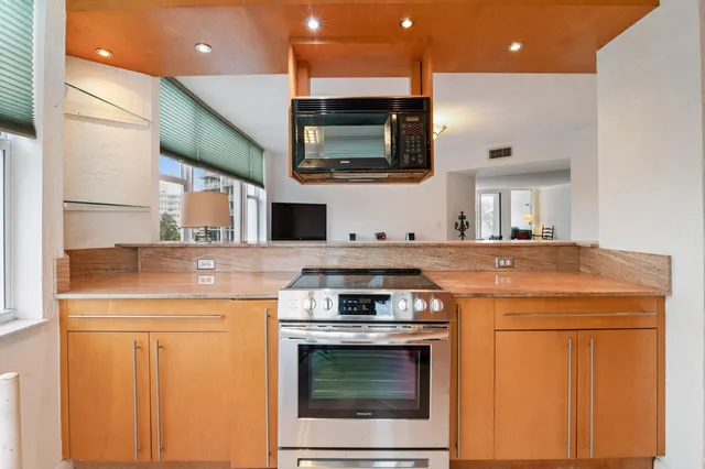 a kitchen with a stove and a microwave