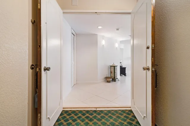 a bathroom with a glass shower door