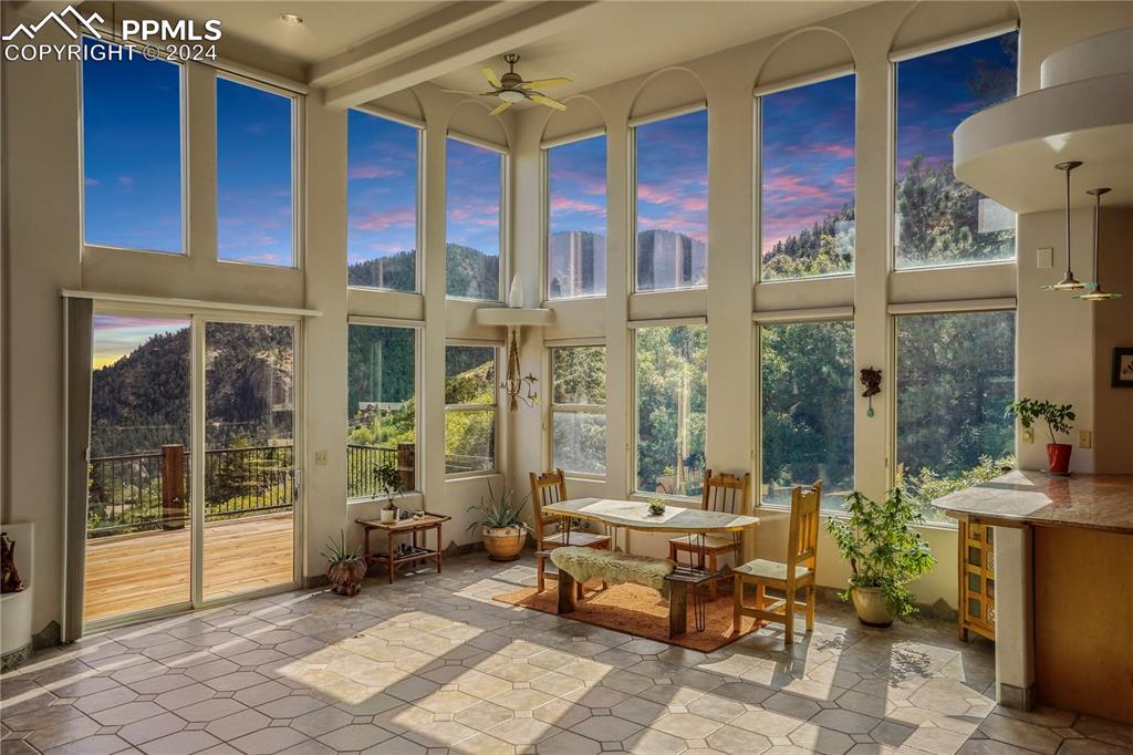 915 Oak Ridge Road Manitou Springs, CO 80829 - Photo 7 of 50 a living room with furniture and large windows
