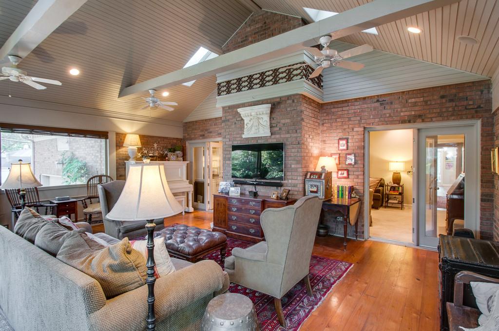 4338 Estes Road Nashville, TN 37215 - Photo 9 of 17 a living room with furniture a large window and wooden floor