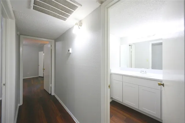 a bathroom with a sink and mirror