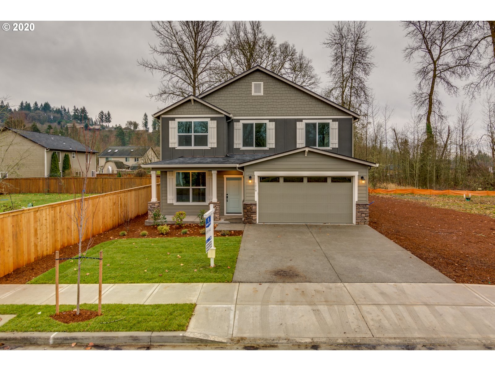 8524 North 1st Street, Unit LT96 Ridgefield, WA 98642 - Photo 1 of 32 a front view of a house with a yard