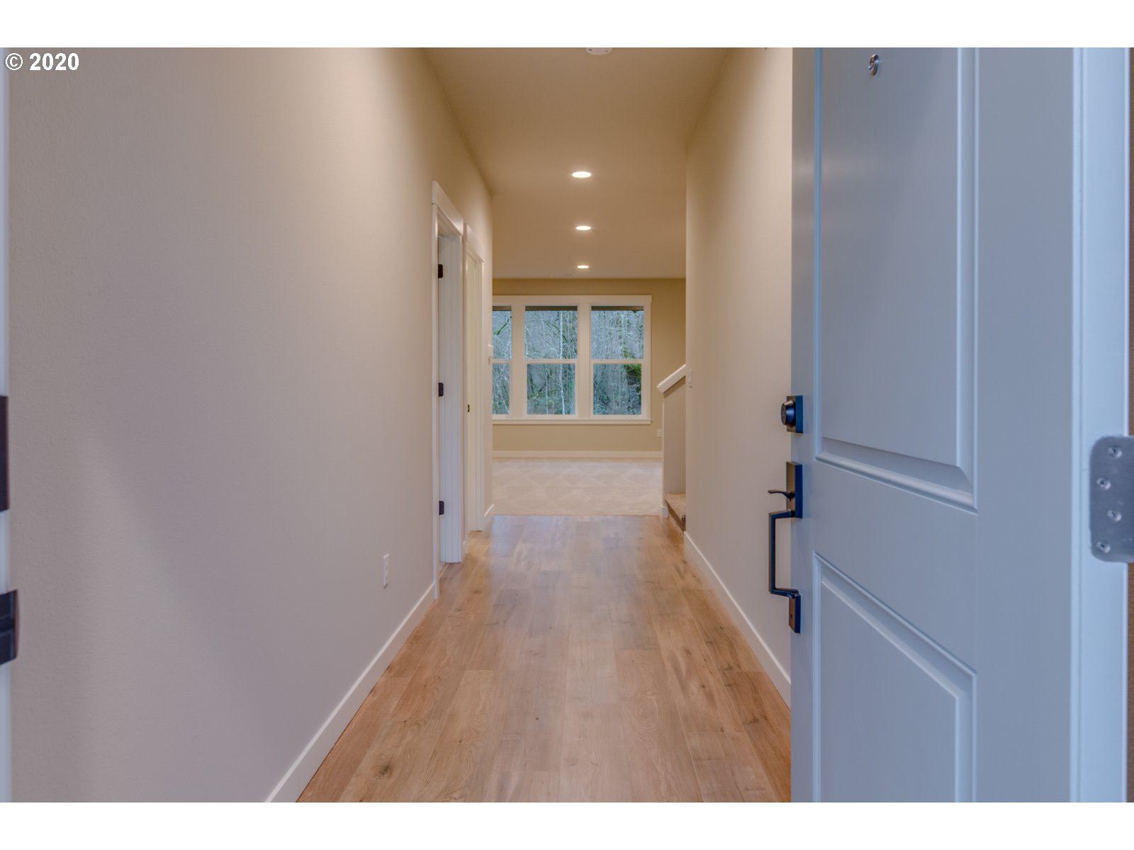 8524 North 1st Street, Unit LT96 Ridgefield, WA 98642 - Photo 2 of 32 a hallway with wooden floor and windows