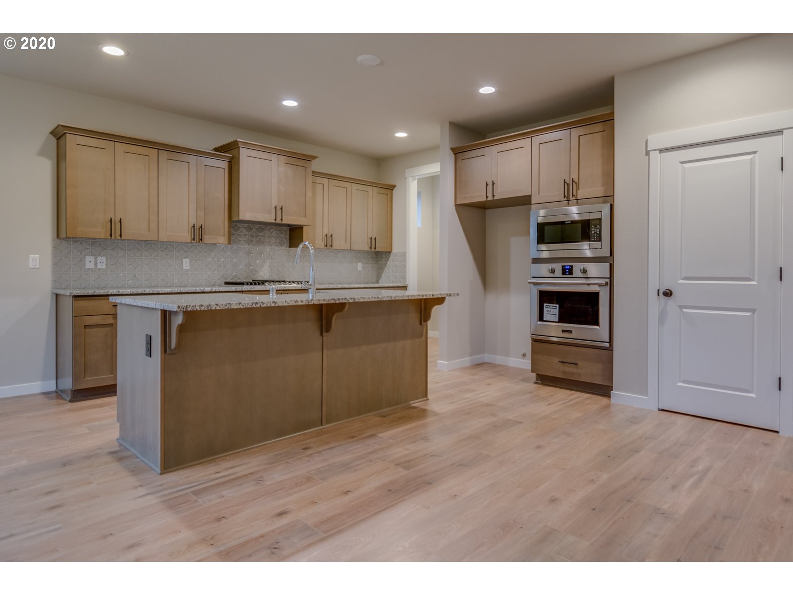 8524 North 1st Street, Unit LT96 Ridgefield, WA 98642 - Photo 12 of 32 a kitchen with stainless steel appliances granite countertop a stove a sink and a refrigerator