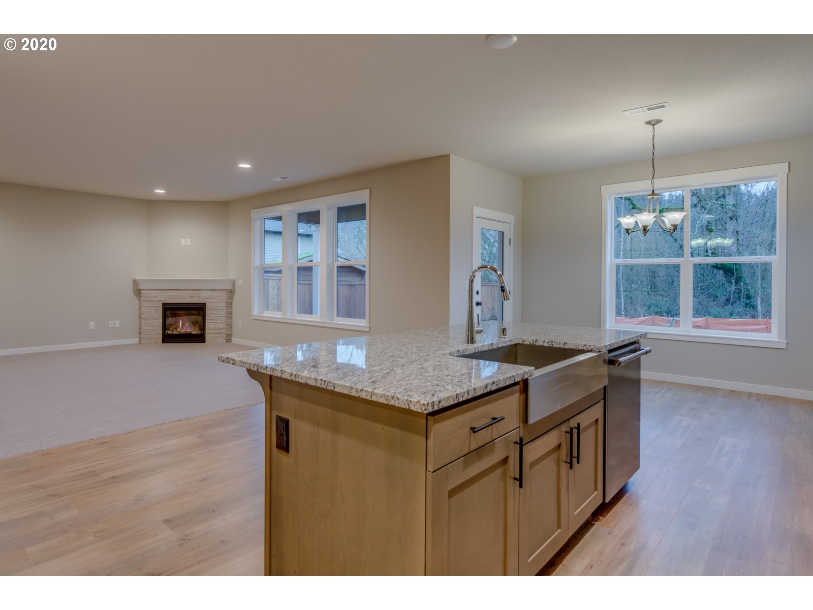 8524 North 1st Street, Unit LT96 Ridgefield, WA 98642 - Photo 15 of 32 a kitchen with granite countertop a stove a sink a counter space and cabinets