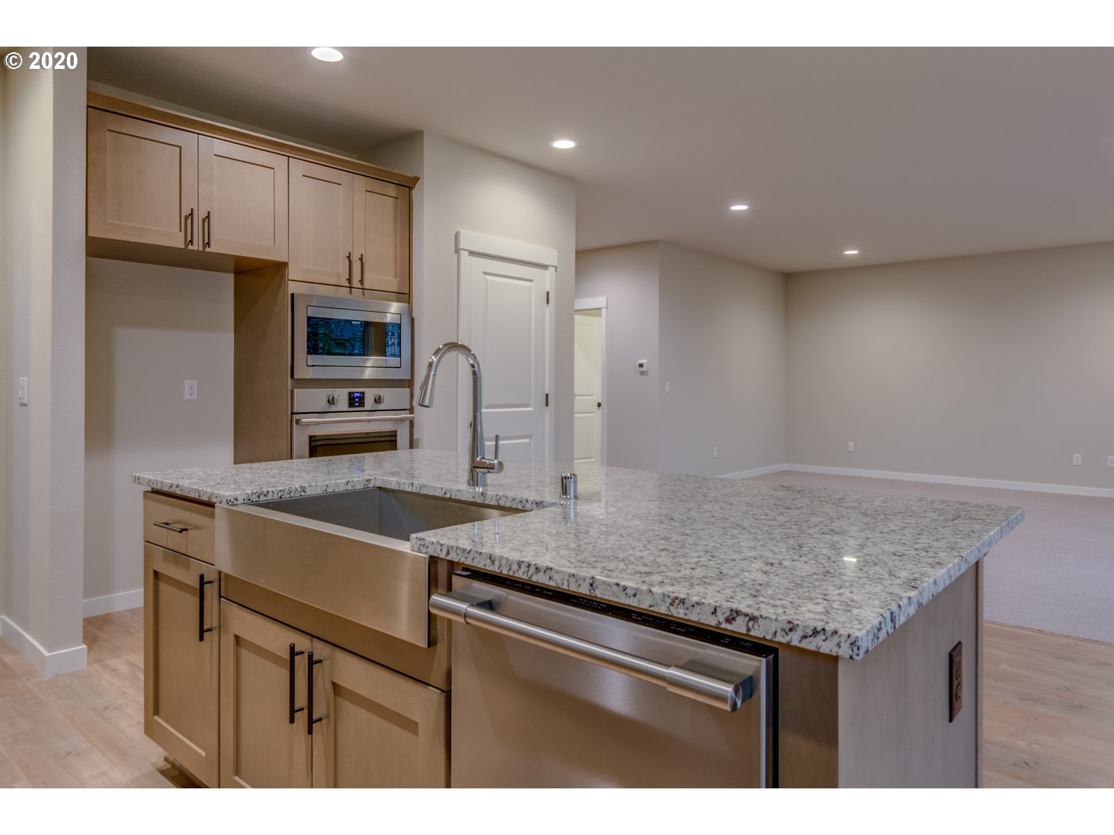 8524 North 1st Street, Unit LT96 Ridgefield, WA 98642 - Photo 18 of 32 a kitchen with a sink a counter space stainless steel appliances and cabinets