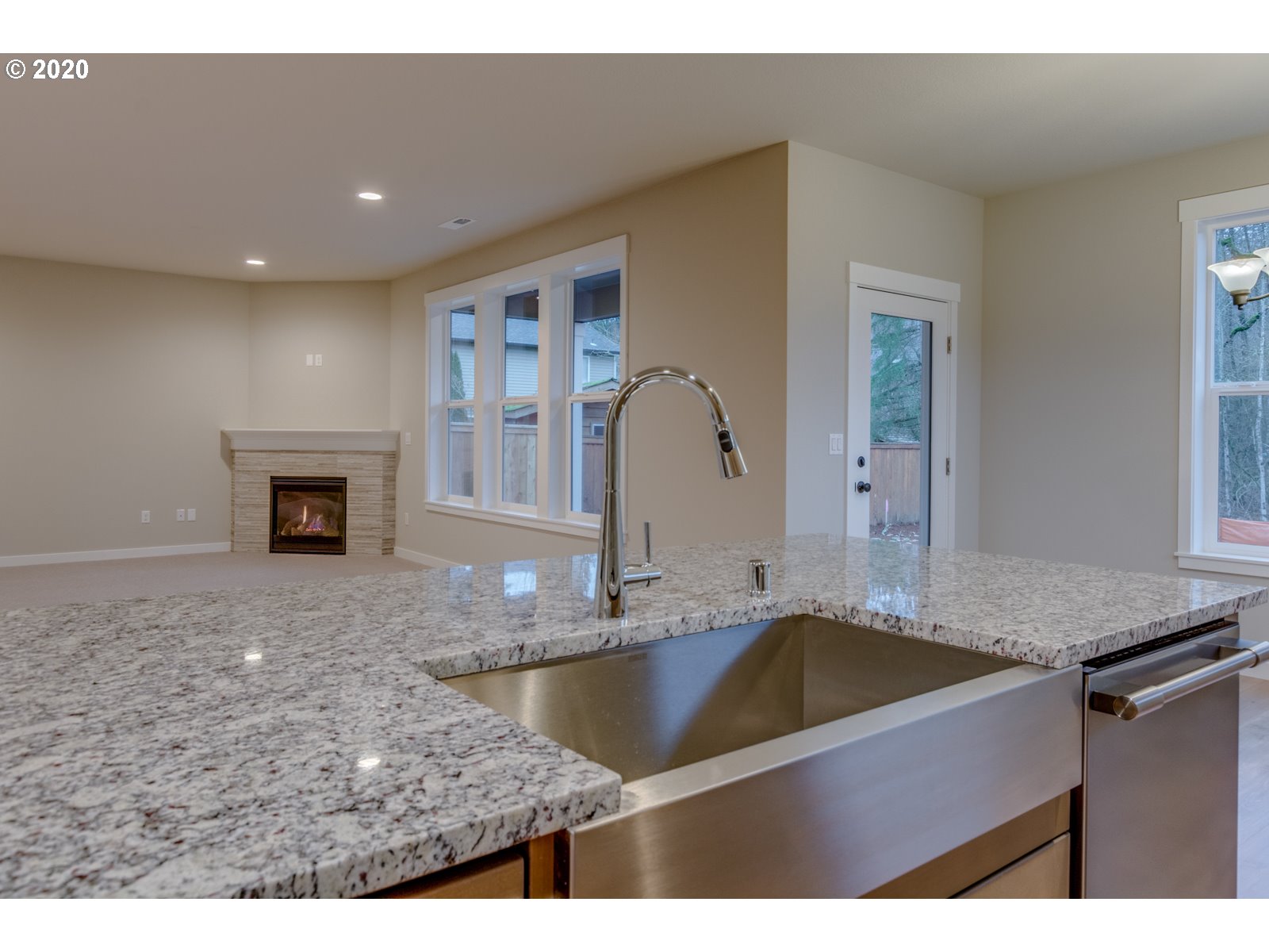 8524 North 1st Street, Unit LT96 Ridgefield, WA 98642 - Photo 21 of 32 a bathroom with a granite countertop sink a mirror and vanity