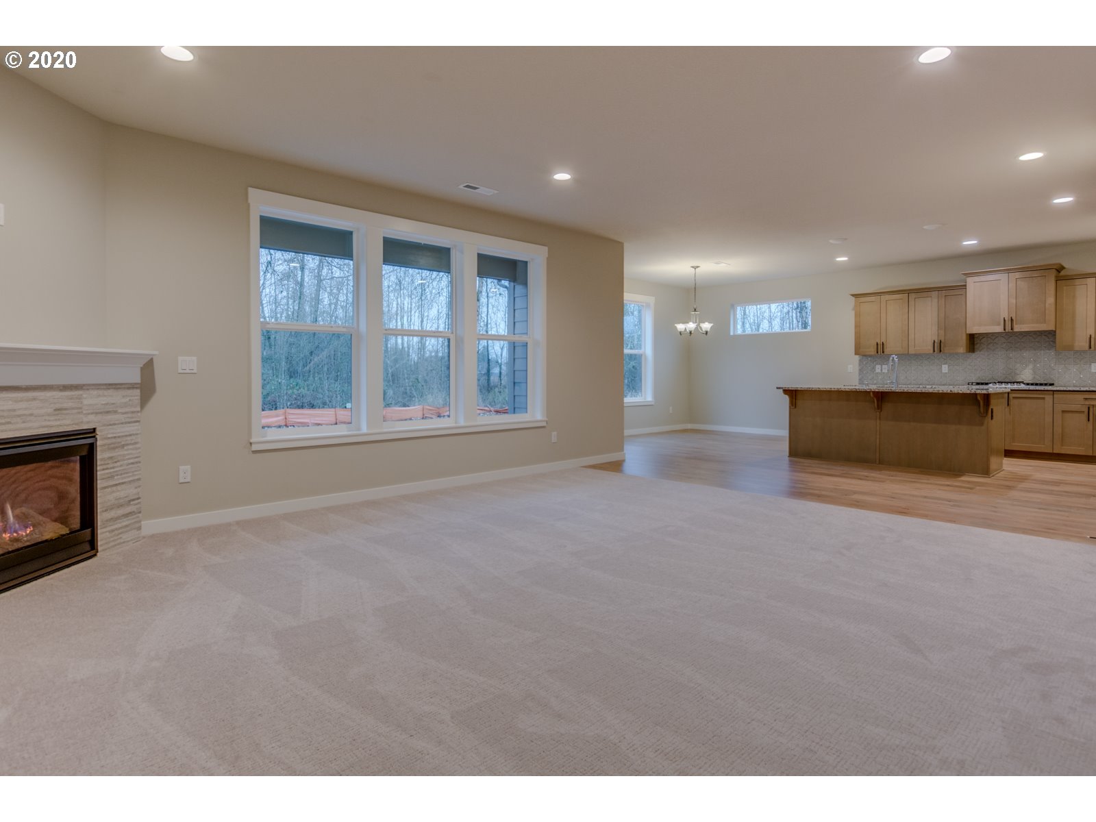 8524 North 1st Street, Unit LT96 Ridgefield, WA 98642 - Photo 27 of 32 a view of an empty room with a fireplace and a window