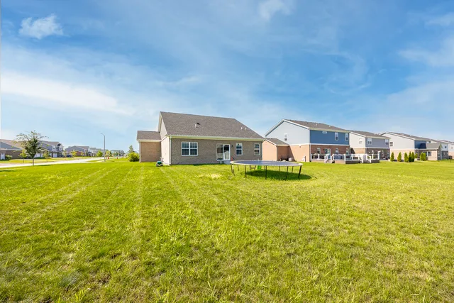a house view with swimming pool in front of it