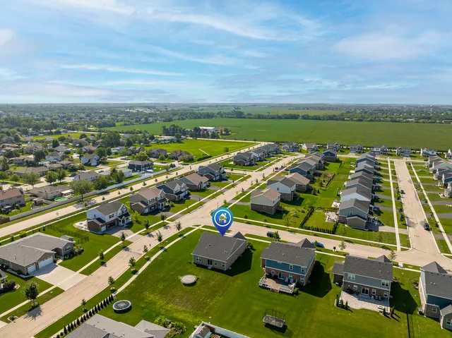 an aerial view of residential houses with outdoor space