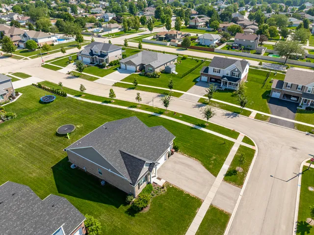 an aerial view of a house with a ocean view