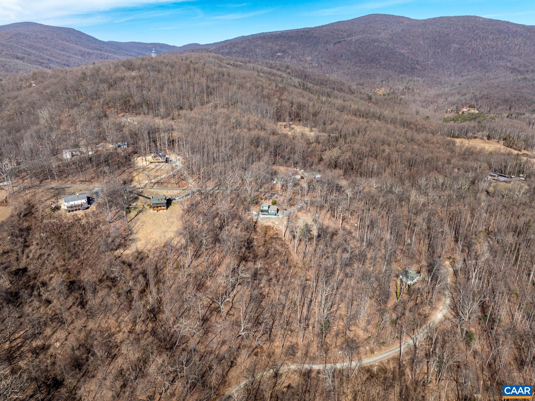 1022 Turkey Ridge Road Stanardsville, VA 22973 - Photo 11 of 74 a view of a dry field with mountains in the background