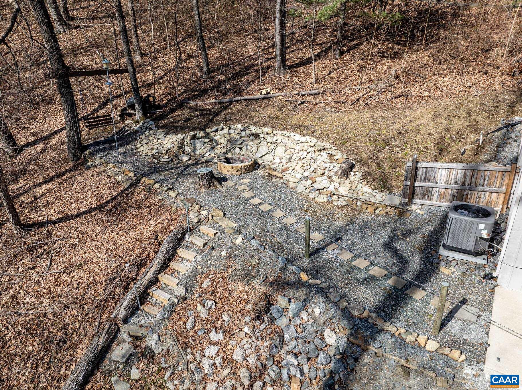 1022 Turkey Ridge Road Stanardsville, VA 22973 - Photo 16 of 74 a backyard of a house with lots of trees