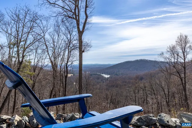 a view of a balcony with a yard