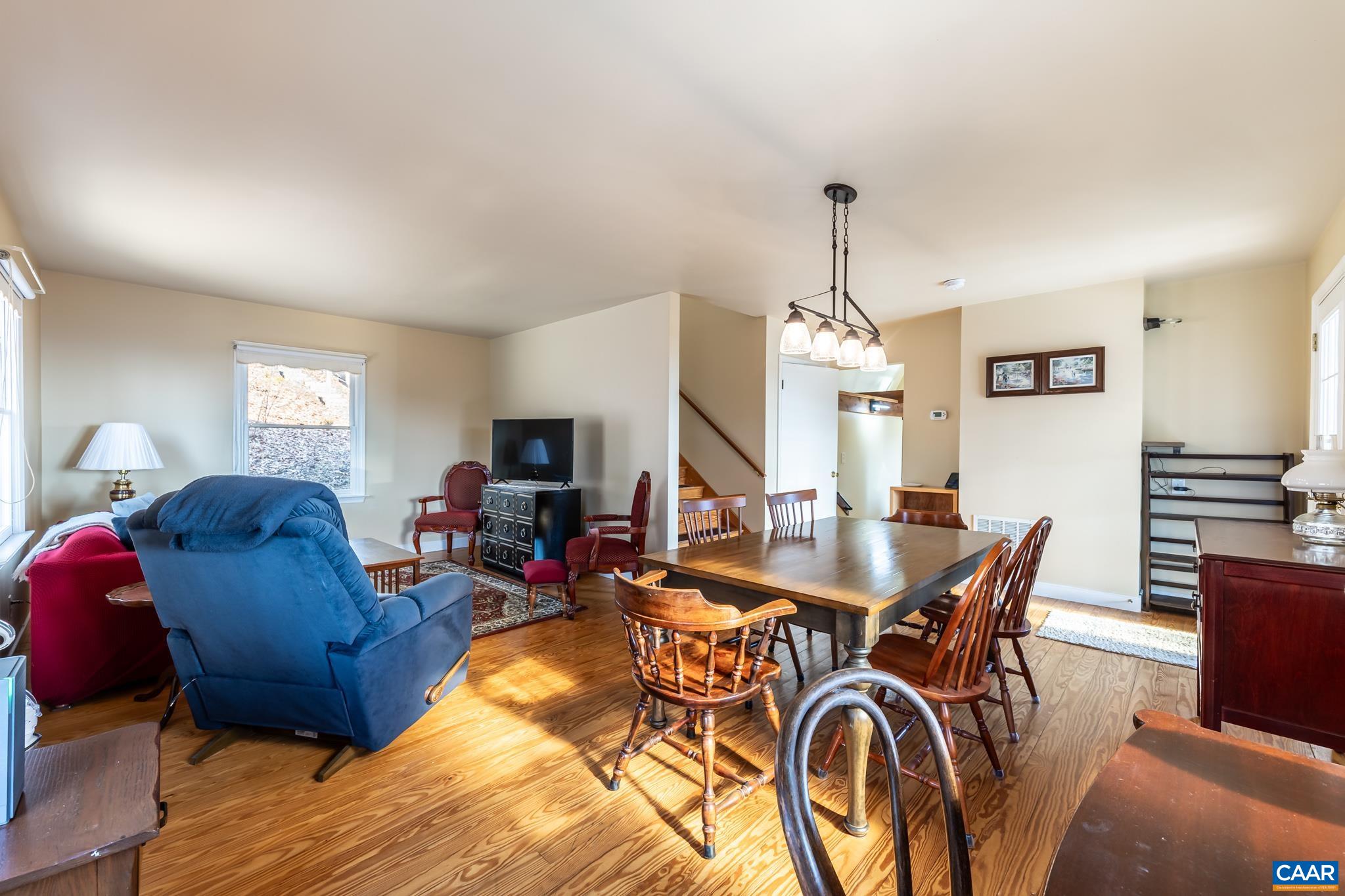 1022 Turkey Ridge Road Stanardsville, VA 22973 - Photo 25 of 74 a view of a dining room with furniture window and wooden floor